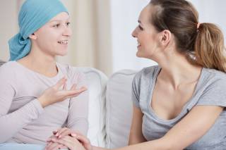 Cancer patient in conversation with health care professional