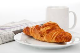 croissant, newspaper and mug