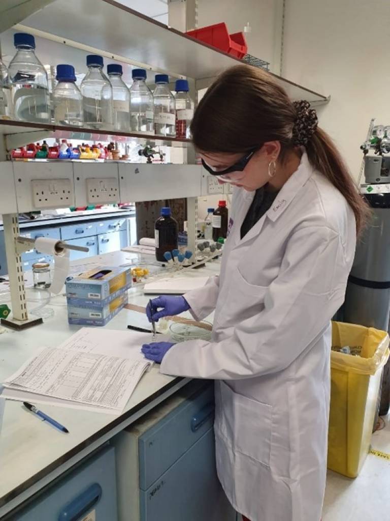 Image of Emily carrying out an experiment in the lab.