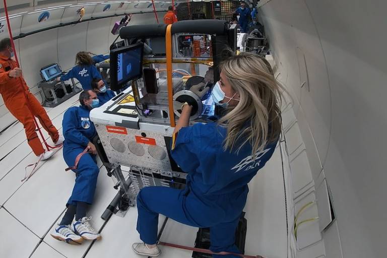 Malica Schmidt, a UCL PhD student, performing experiments in microgravity aboard a parabolic flight.