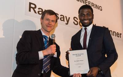 David Newton Award winner Dami Taiwo presented a certificate by Pro.Marc-Olivier Coppens