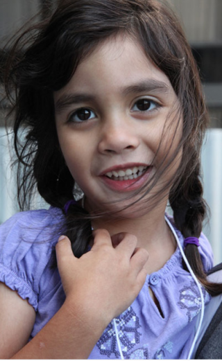 Little girl in purple top
