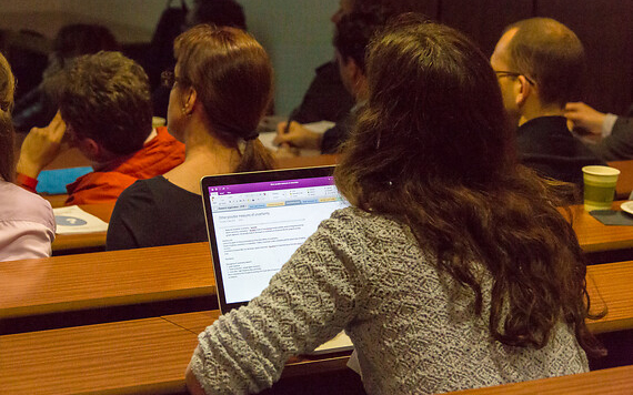 female student on laptop in lecture