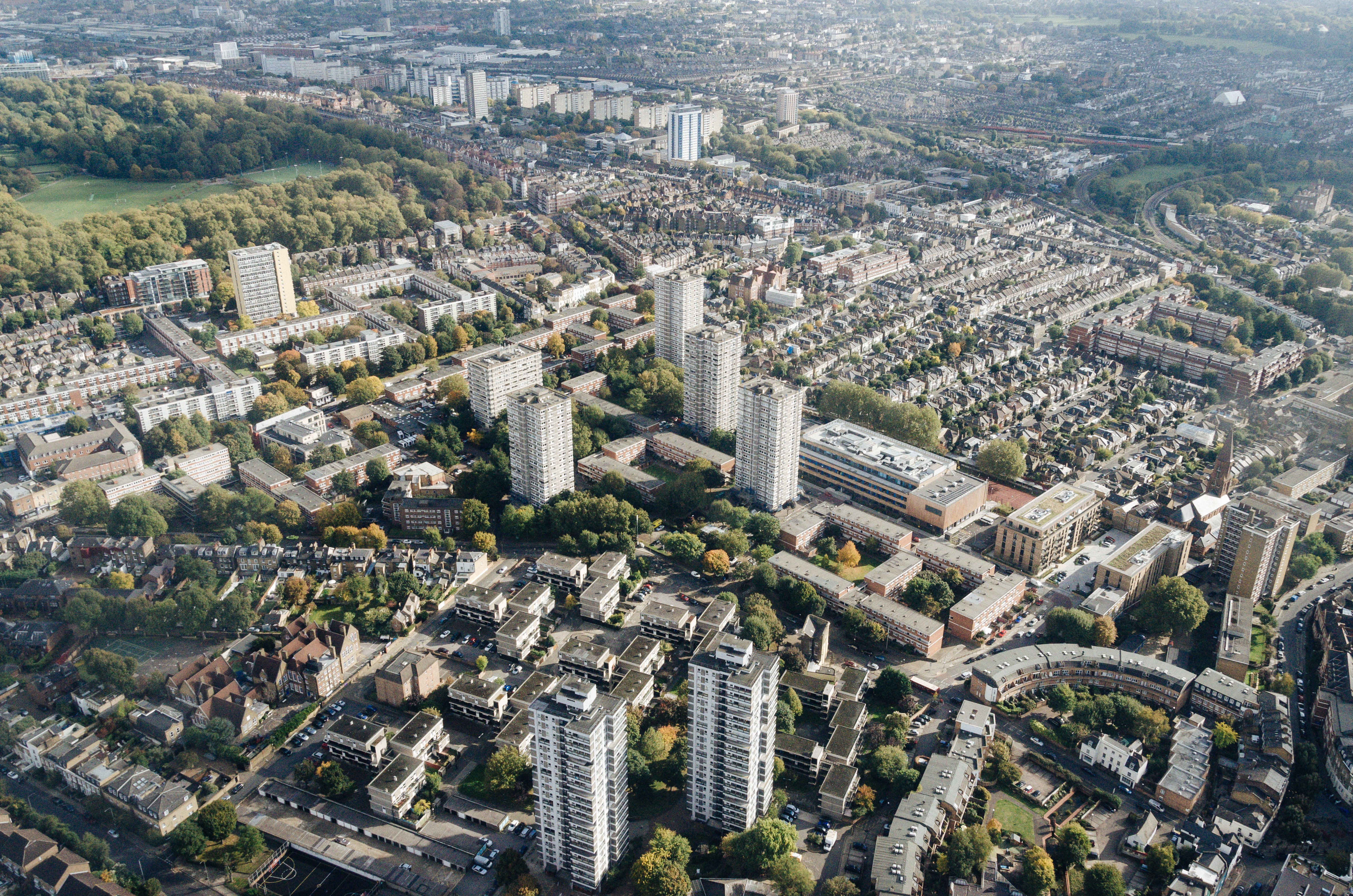 Aerial view of London urban infrastructure such as buildings, roads, and trees