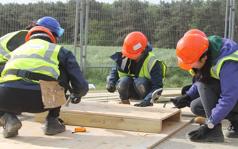 Students hammering wood at the Constructionarium 2018.