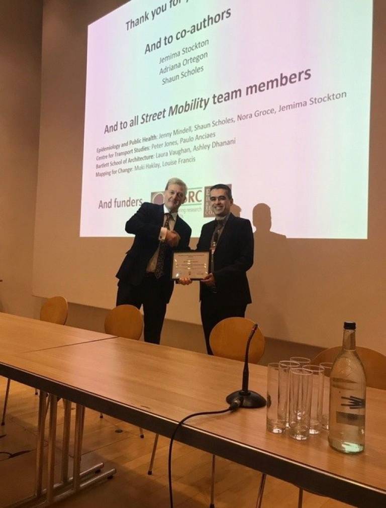 Prof David Lomas presenting CEGE's Dr Ancieas with the UCL Excellence in Health Research Award 2019 