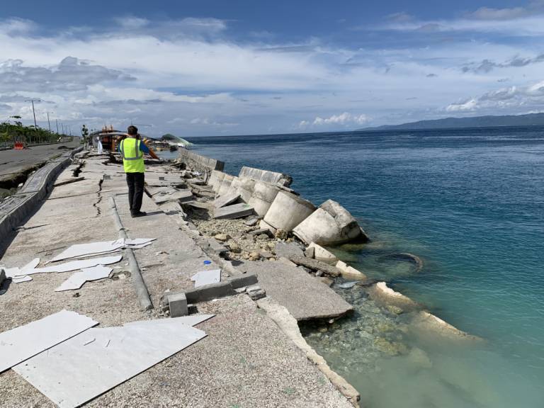 An EEFIT member assessing coastal damage in Palu, Sulawesi, Indonesia