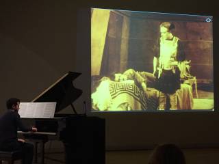 The pianist Michele Sganga accompanies a silent film about Julius Caesar