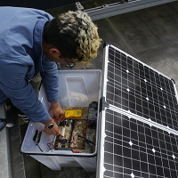 student with solar panel
