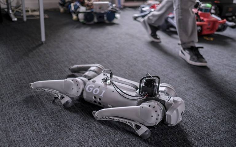 Grey Robot lying down on the floor