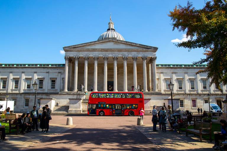 Red Bus in the UCL  front Quad in front of the Wilkins Portico.