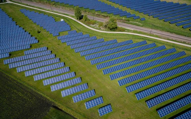 Solar panels in a field arial view sustainable development
