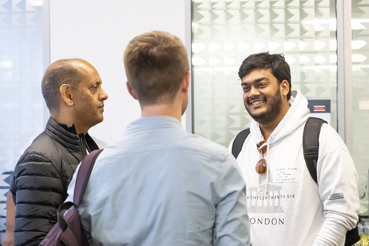 Three alumni chatting at UCL Computer Science Summer Mixer Event 2022