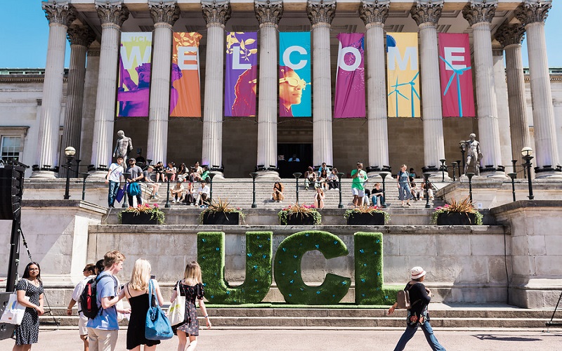 UCL front quad with green UCL sign 