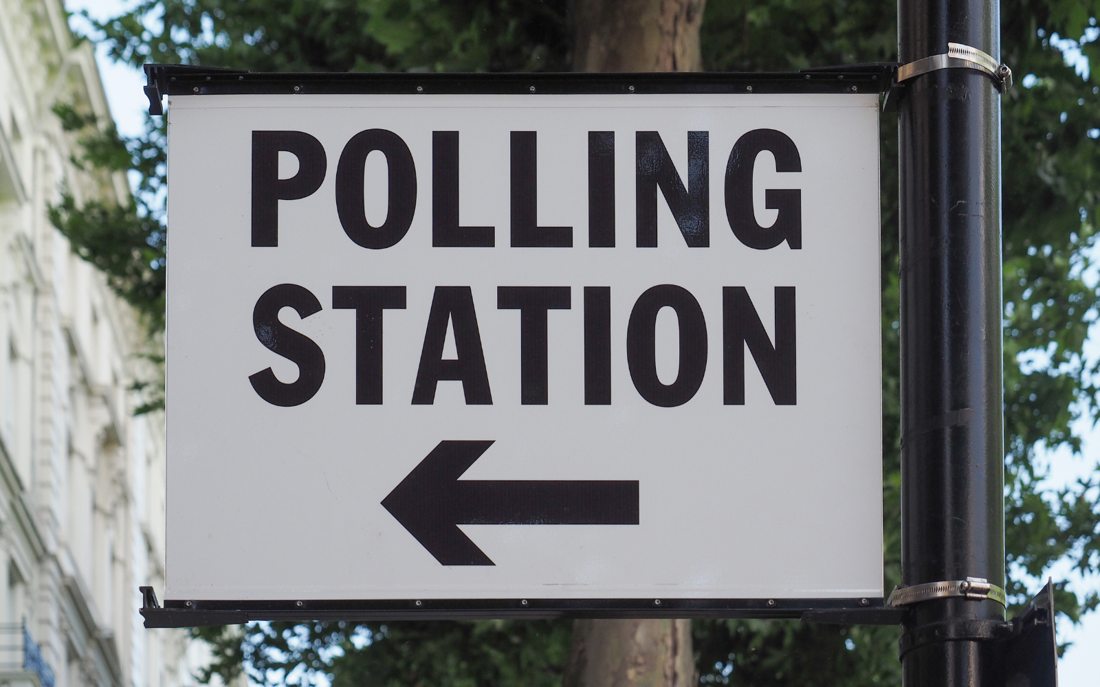 A polling station sign.