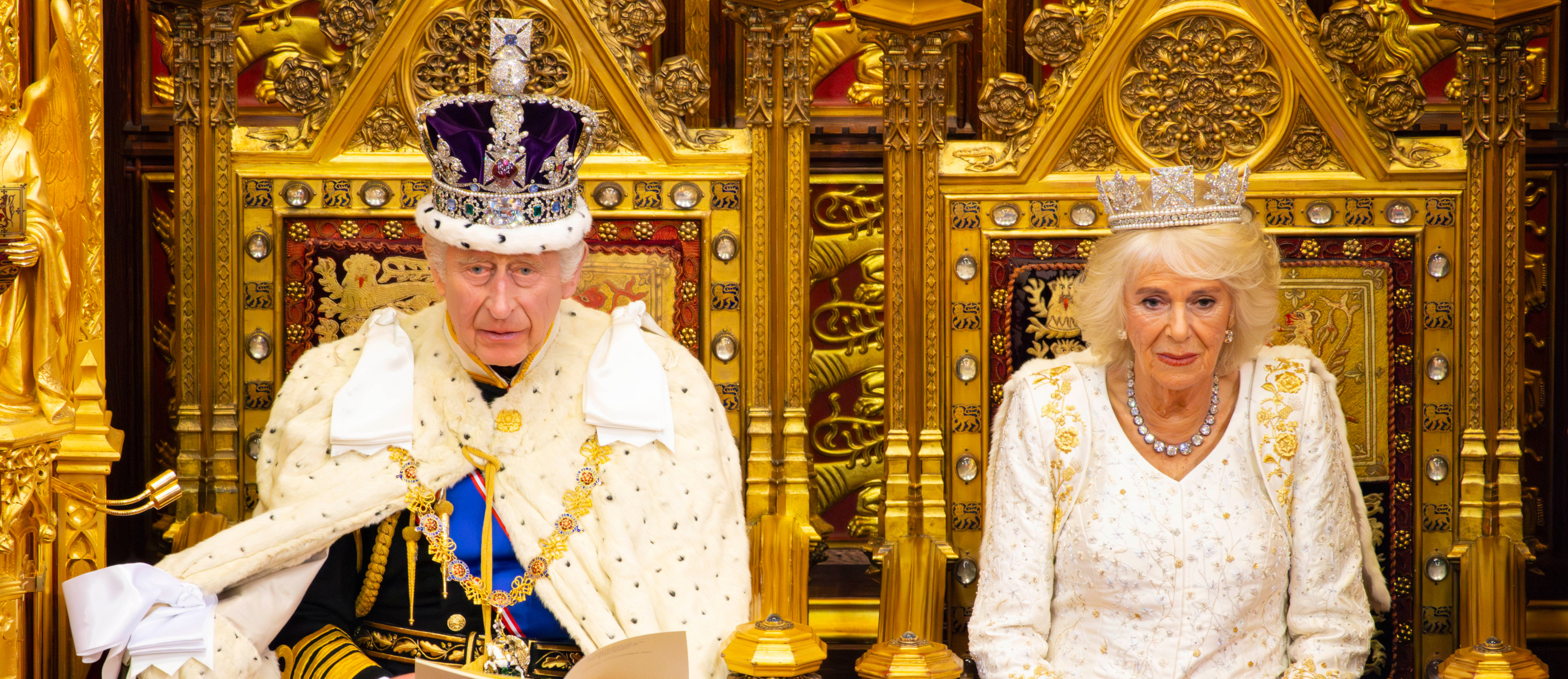 Charles III and Camilla sitting on the sovereign's throne at the state opening of parliament in 2023