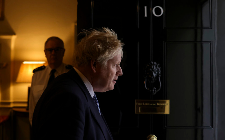 Boris Johnson, prime minister staring out of the door to number 10 Downing Street.