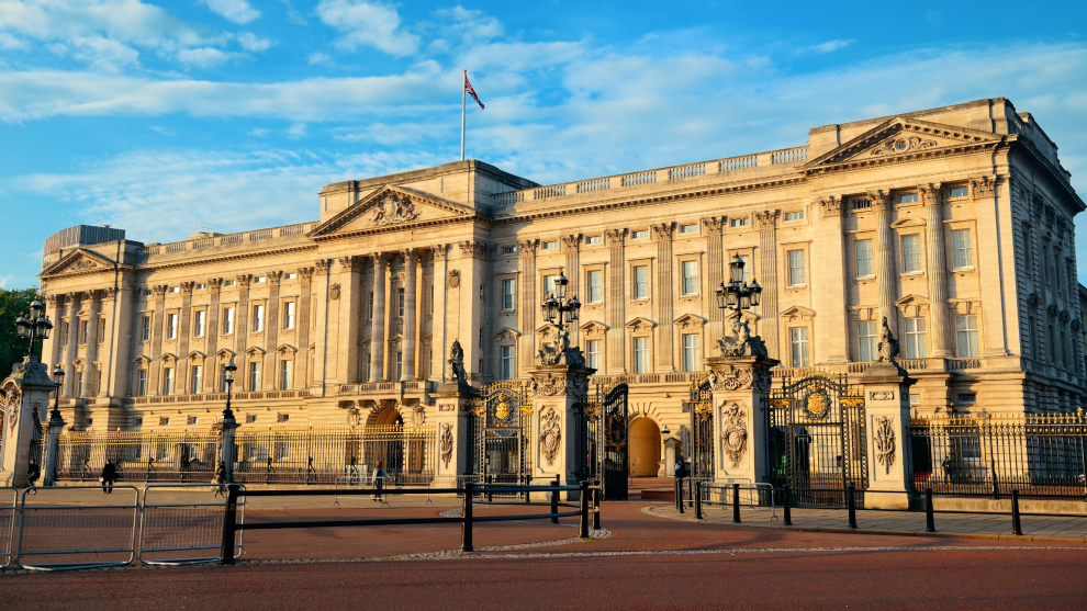 Buckingham Palace in front of a blue sky.