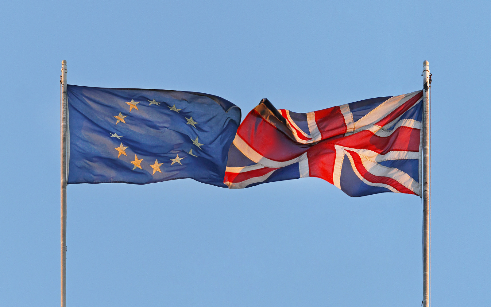 A UK and an EU flag.