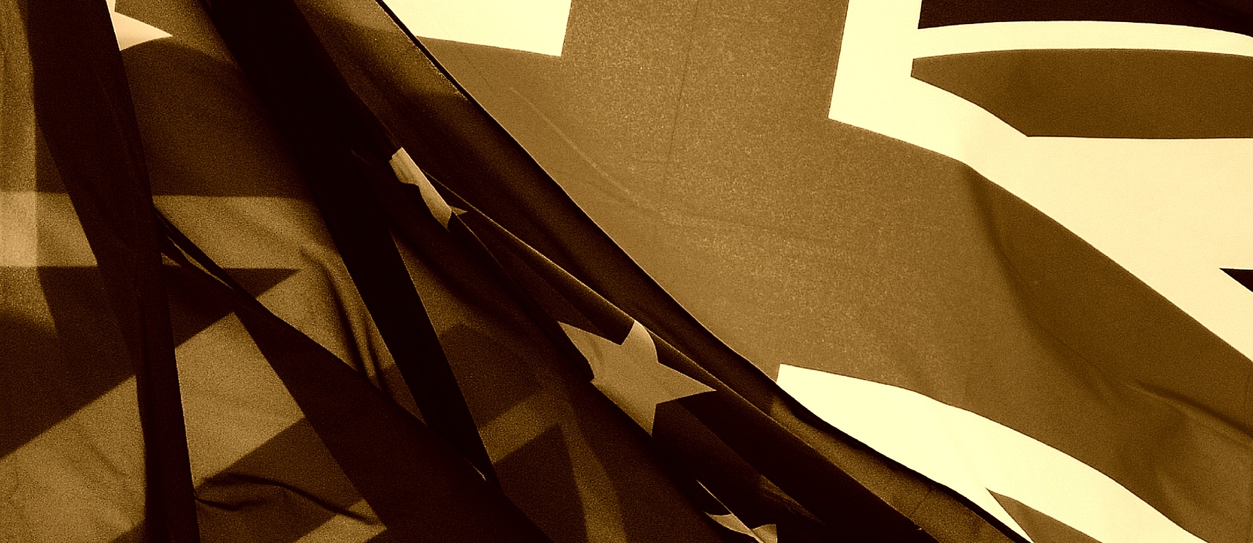 A UK and EU flag in sepia