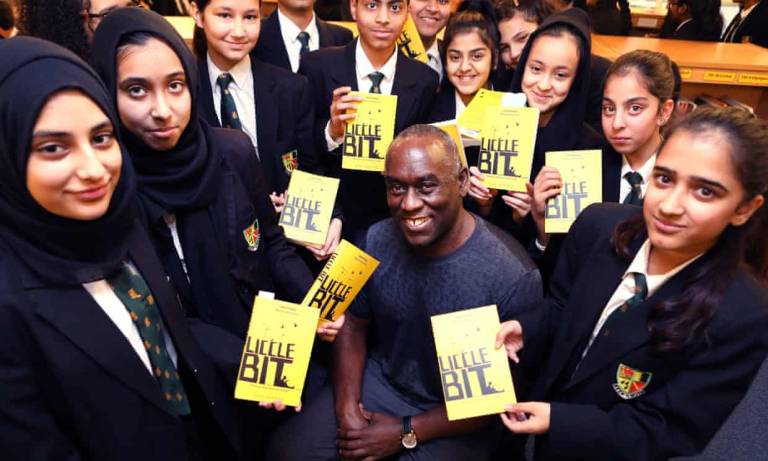 YA author Alex Wheatle, pictured with pupils at Yardleys School, Birmingham