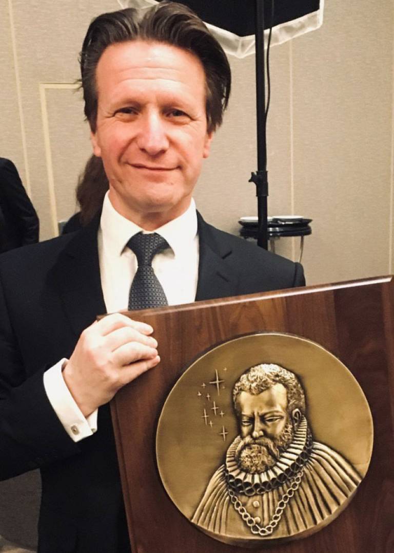 Professor Marek Ziebart and his award