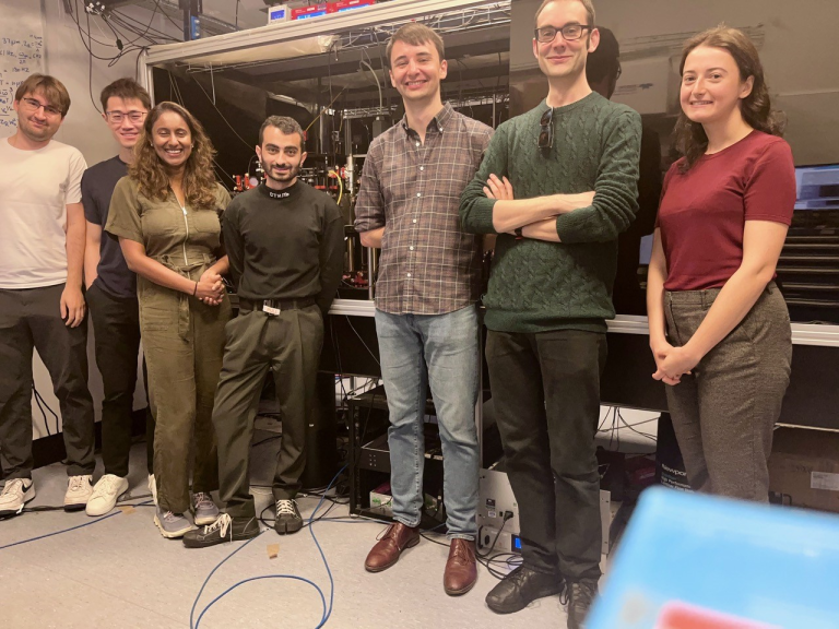 Some members of the QSimFP team in front of the Cambridge experiment