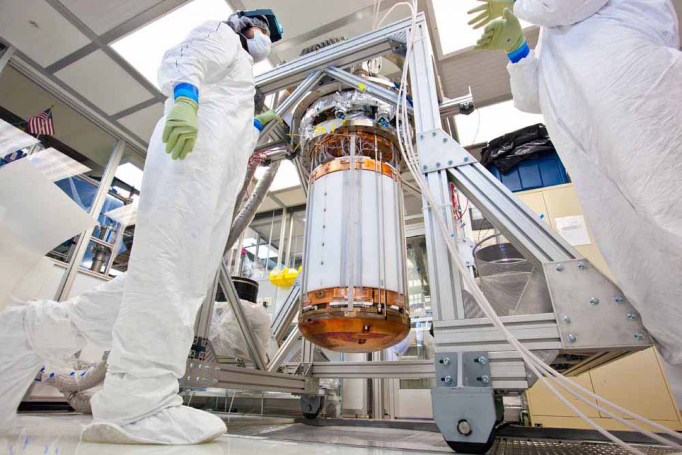 LUX researchers, seen here in a clean room on the surface at the Sanford Lab, work on the interior of the detector, before it is inserted into its titanium cryostat, Lawrence Livermore National Laboratory…