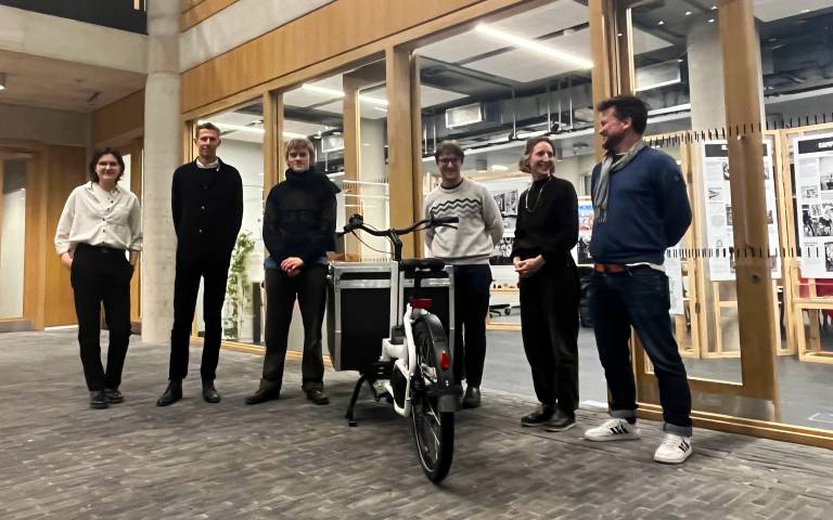 Staff and students at the handover of the memory bike