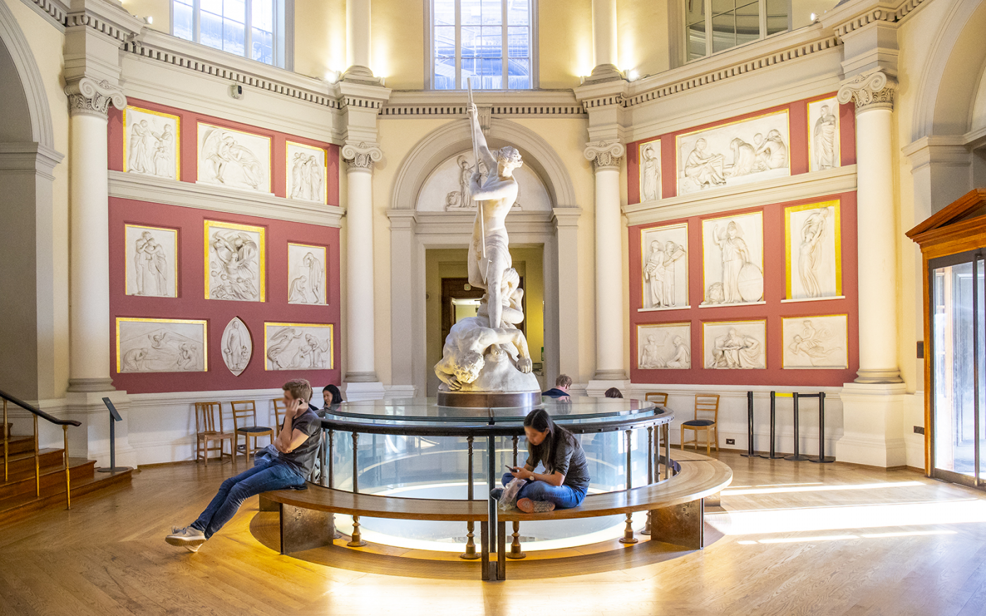 The Flaxman Gallery situated beneath the UCL Dome with students sitting