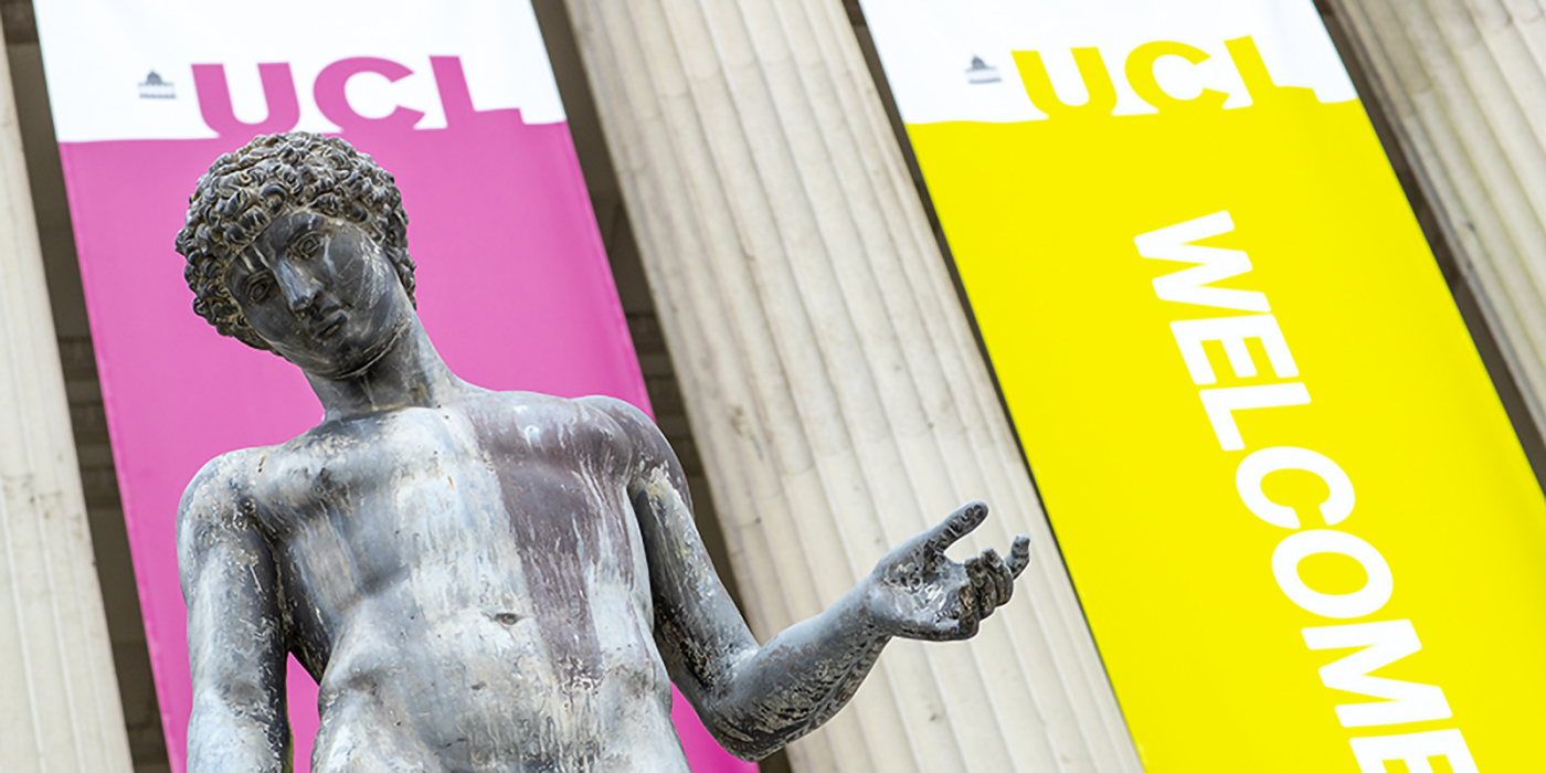 One of the Portico statues, and banners tied to the Wilkins building columns, welcome new students to UCL