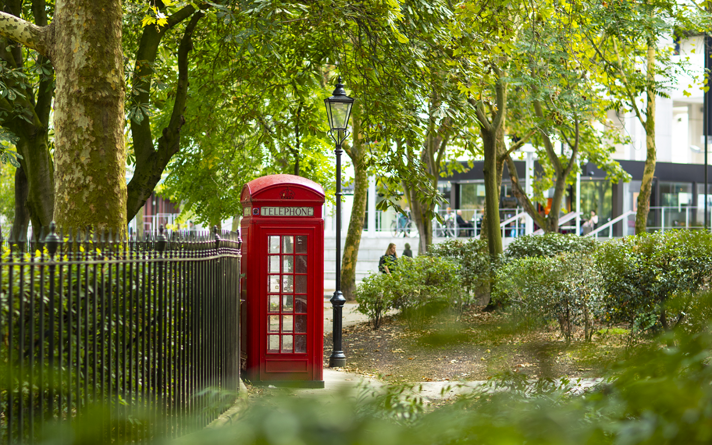Red Telephone Box in a leafy Brunswick Square
