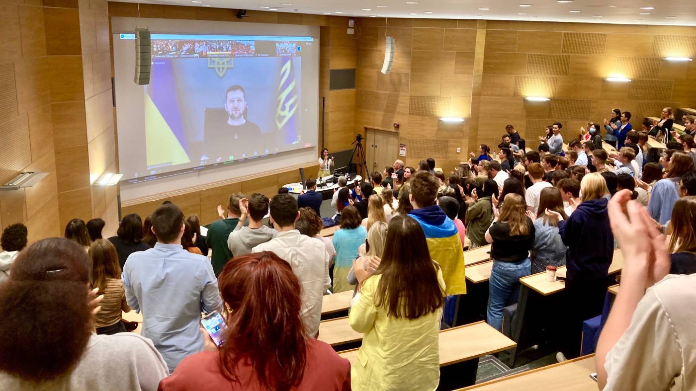 Lecture theatre event showing screen and participation in an online discussion with Ukrainian President, Volodymyr Zelenskyy. 