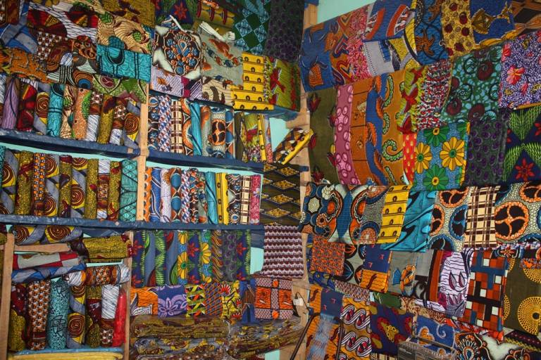 waxprints sold in a shop in west africa photo by alexander sarlay