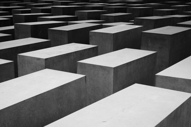 Photograph of grey concrete blocks in rows which get smaller as you move diagonally from the bottom right hand corner to the top left corner. 