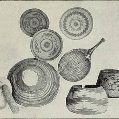 Black and white photograph of a selection of different woven baskets.