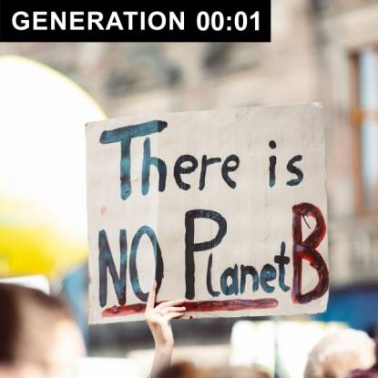 A protestor holds a sign that reads, there is no planet B
