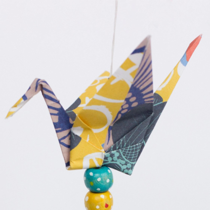 An origami bird made from patterned coloured paper