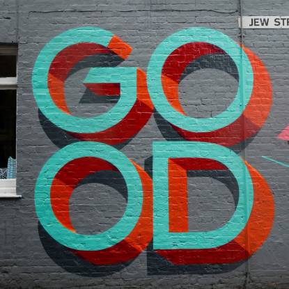 Text on a wall 'Good'