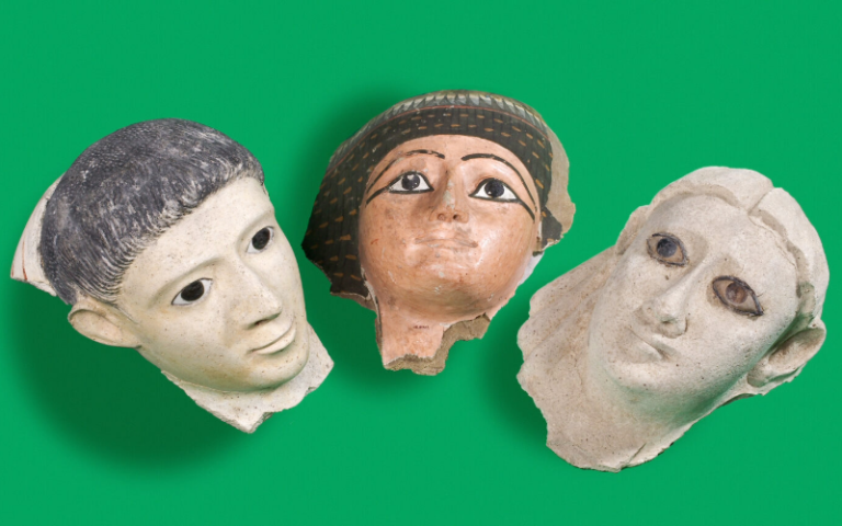Photograph of three ancient Egyptian artefacts of clay pottery faces.