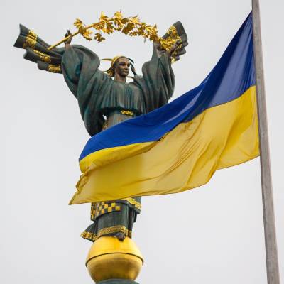 Ukraine flag and independence monument
