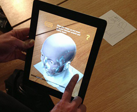 App showing facial reconstruction over skull UC31176
