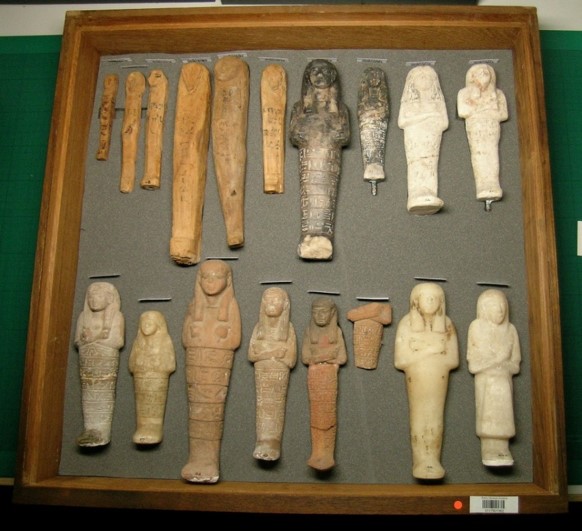 The shabtis rehoused in secure holdings using plasterzote and acid-free tissue paper.