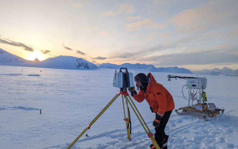 Antarctica Using the laser scanner on a nearby glacier, with our sled-mounted radar in the background.