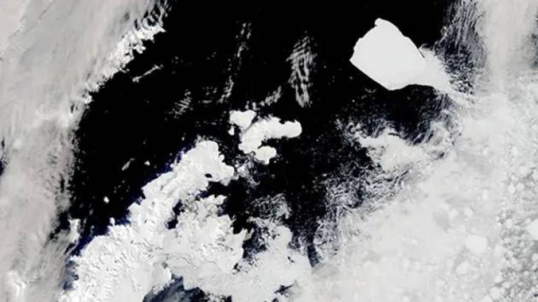 On November 27, 2023, a break in the swirling cloud cover allowed a glimpse of the Earth’s largest iceberg drifting past the tip of the Antarctic Peninsula. Courtesy: NASA Modis