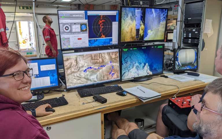 Dr McFall is in the control room of of HyBIS, our remote underwater vehicle (RUV) with a couple of the RUV pilot team. 