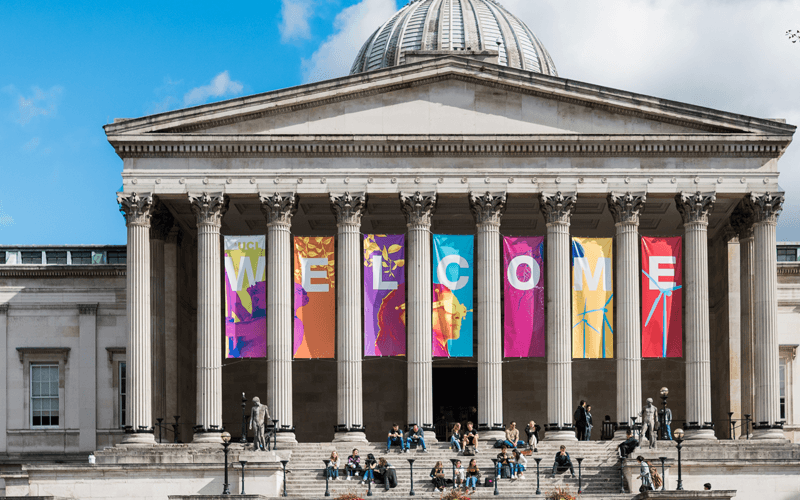 Image of UCL colonnades with multicoloured banners saying 
