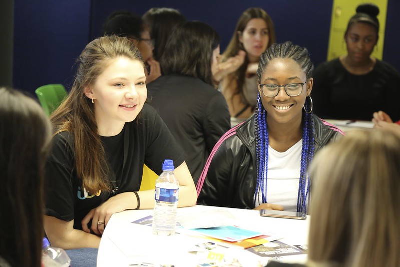Two teenage girls at a STEM education engagement event.