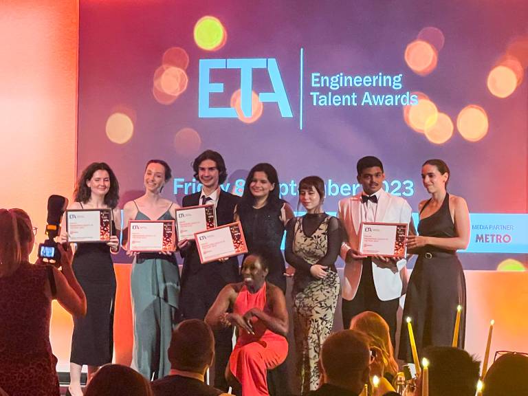 The nominees for Engineering Society of the Year are on stage, holding their certificates.