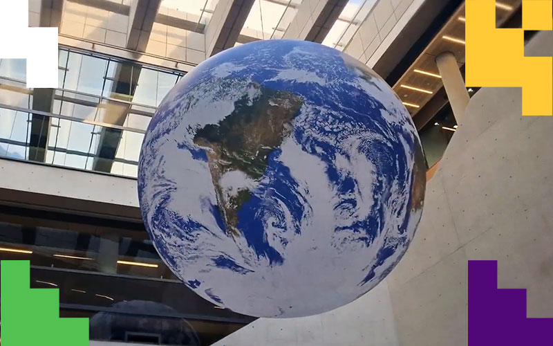Image of the Gaia Instalation, an inflated globe in the atrium area of UCL Marshgate building